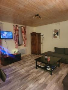 Posezení v ubytování Le hameau du Maissubert