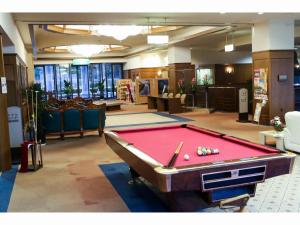 a pool table in the middle of a room at HOTEL WINDSOR in Nakatsugawa