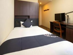 Ένα ή περισσότερα κρεβάτια σε δωμάτιο στο Business Hotel Shinkawa Ube +108 φωτογραφίες