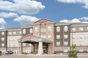 a rendering of the front of a hotel at Ramada by Wyndham Olds in Olds