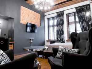 a living room with a couch and a table at Leonardo 2 in Krakow