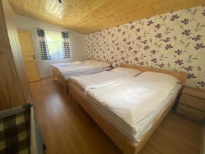 Postel nebo postele na pokoji v ubytování Domček pri Medzihorskej