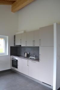 Kuchyň nebo kuchyňský kout v ubytování Appartement Lens