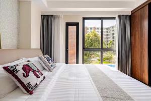 Postel nebo postele na pokoji v ubytování The One Chiang Mai 214 - Family Suite 2BR 2bath, Pool View near Central Festival + 73 fotografií