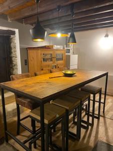a large wooden table with chairs in a kitchen at Chalet coeur d'alpage La Plagne Les Arcs in La Plagne Tarentaise +36 photos