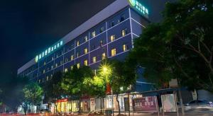 a blue building with a sign on top of it at City Comfort Inn Hotel Beihai Hunan Road Ancient Street in Gaode