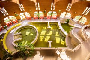 an overhead view of a large building with a pool at Tisia Hotel & Spa in Tiszaújváros +102 photos