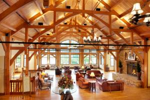 a large living room with a large wooden ceiling at Stonewall Resort in Roanoke