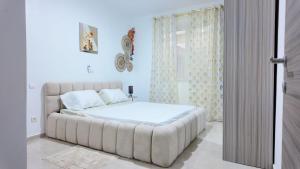 Ένα ή περισσότερα κρεβάτια σε δωμάτιο στο Résidence Maison des Anges