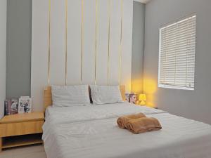 Ένα ή περισσότερα κρεβάτια σε δωμάτιο στο LV TPHomes