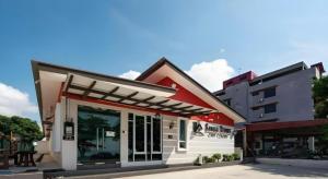 a store front with a red and white building at Sg Rengit City Resort 2 in Kampung Sungai Rengit +14 photos