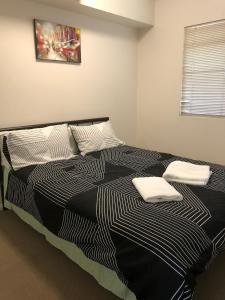 Postel nebo postele na pokoji v ubytování Resort Style Apartment on Gregory + 13 fotografií