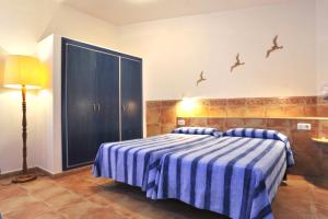 Posteľ alebo postele v izbe v ubytovaní Apartaments El Berganti en Canyelles Petites
