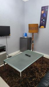 TV a/nebo společenská místnost v ubytování Vasco Geusthouse