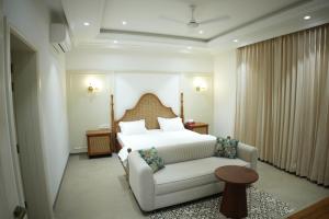 Ένα ή περισσότερα κρεβάτια σε δωμάτιο στο Kaayanaat Villa