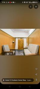 Ένα ή περισσότερα κρεβάτια σε δωμάτιο στο The vivekam Homestay nr Hindustan college Nava india