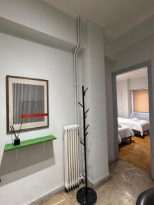 Ένα ή περισσότερα κρεβάτια σε δωμάτιο στο Patras City Stay 4