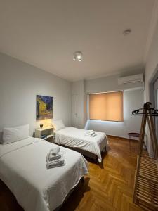 Ένα ή περισσότερα κρεβάτια σε δωμάτιο στο Patras City Stay 4