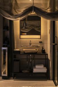 a bathroom with a sink and a mirror at moire Edo Hotel Asakusa in Tokyo
