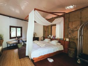 a bedroom with a bed with a canopy at LATERAL - Vacation STAY 36594v in Shiojiri