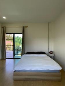 Ένα ή περισσότερα κρεβάτια σε δωμάτιο στο TT Haus Chiangdao +22 φωτογραφίες