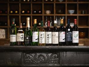 a bunch of bottles of wine sitting on a table at LATERAL - Vacation STAY 36610v in Shiojiri +72 photos