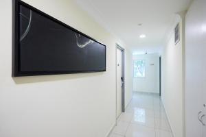 TV de pantalla plana en la pared del pasillo en Hotel Sunjoy9 OKR, en Kuala Lumpur 46 fotos más