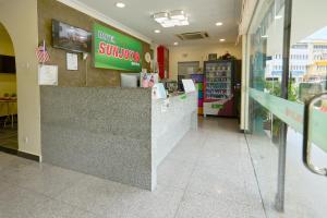 a fast food restaurant with a counter in a store at Hotel Sunjoy9 OKR Near Midvalley 10 Mins Only in Kuala Lumpur