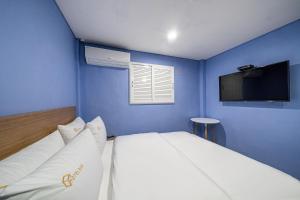 Ένα ή περισσότερα κρεβάτια σε δωμάτιο στο 박스호텔