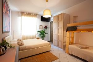 Postel nebo postele na pokoji v ubytování B&B La Volpina