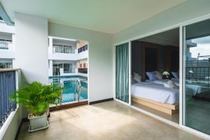 Postel nebo postele na pokoji v ubytování Casa Del M Patong Phuket - Newly Renovated + 38 fotografií