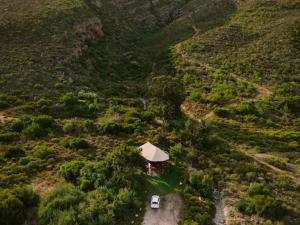 an aerial view of a house and a van in a field at Majestic wonders in Knysna +5 photos