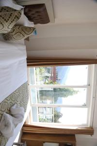 Postel nebo postele na pokoji v ubytování hotel yog tapovan