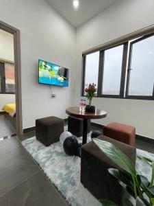 TV a/nebo společenská místnost v ubytování Căn hộ Đà Lạt Cảnh