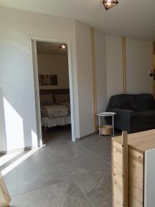 a living room with a couch and a bed at Villa Raggio di Sole in Abbadia Lariana +11 photos