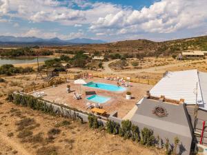 an overhead view of a swimming pool in a field at AfriCamps Klein Karoo in Oudtshoorn
