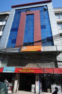 a large building with a hotel ambassador sign on it at Hotel Ganga Sagar in Kathmandu
