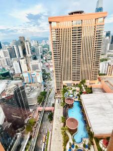an aerial view of a city with tall buildings at Millennium Suites At Berjaya Times Square KL in Kuala Lumpur