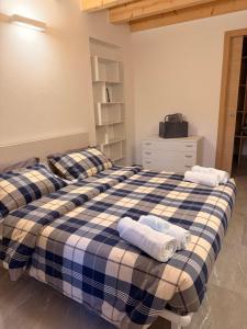 Postel nebo postele na pokoji v ubytování Appartamento Ambro