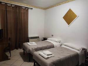 Ένα ή περισσότερα κρεβάτια σε δωμάτιο στο Il Rifugio