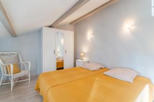 Postel nebo postele na pokoji v ubytování Fleur de Thym