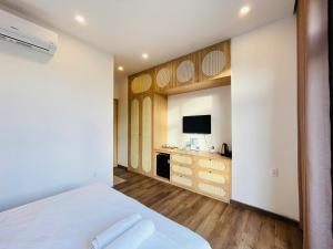 TV a/nebo společenská místnost v ubytování Pavilion Coffee and Homestay