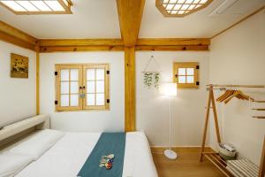 Postel nebo postele na pokoji v ubytování Insarang