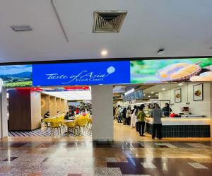 a food court in a mall with people walking around at Millennium Suites At Berjaya Times Square KL in Kuala Lumpur +159 photos