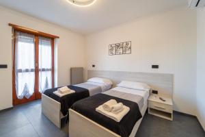 Ένα ή περισσότερα κρεβάτια σε δωμάτιο στο Da Cichin 1 - Free Parking, Wi-Fi & AC