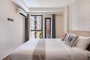 Postel nebo postele na pokoji v ubytování The One Chiang Mai 420 - Deluxe 1BDR Pool View near Central Festival + 73 fotografií