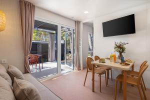 a living room with a couch and a table at Pinadria Adriatic Coast in Baška Voda