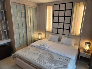 Ένα ή περισσότερα κρεβάτια σε δωμάτιο στο S condo Nimman 2Bedrooms +14 φωτογραφίες