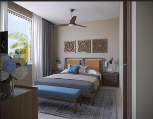 Ένα ή περισσότερα κρεβάτια σε δωμάτιο στο Estherea Elite Morjim