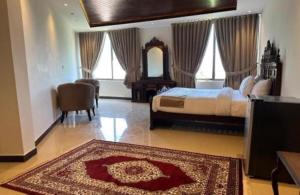 Giường trong phòng chung tại Miramonte Lodges